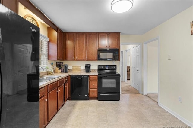 kitchen with sink and black appliances