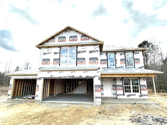 unfinished property with a garage