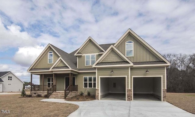 craftsman-style home with a porch and a garage