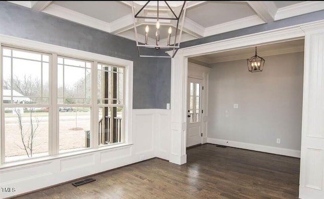 unfurnished dining area featuring beam ceiling, dark hardwood / wood-style flooring, plenty of natural light, and crown molding