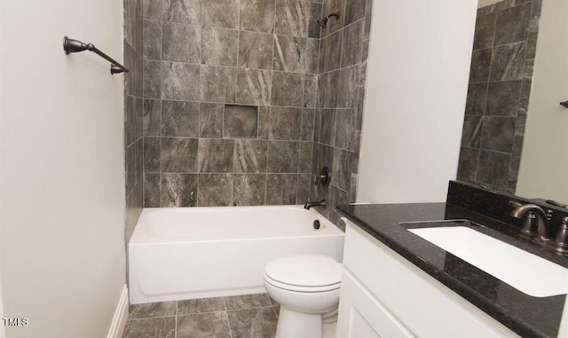 full bathroom with tile patterned flooring, vanity, toilet, and tiled shower / bath