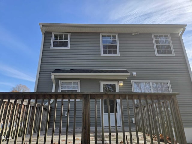 rear view of house featuring a deck