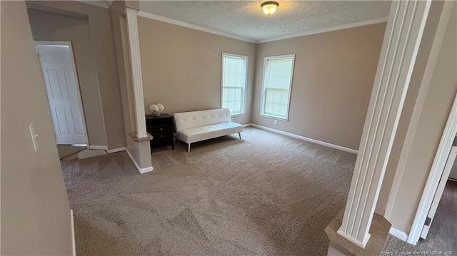 living area featuring carpet floors, baseboards, and crown molding