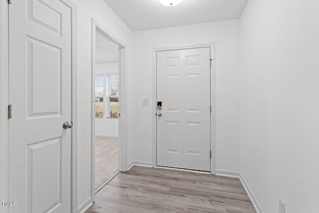 doorway to outside with light hardwood / wood-style floors