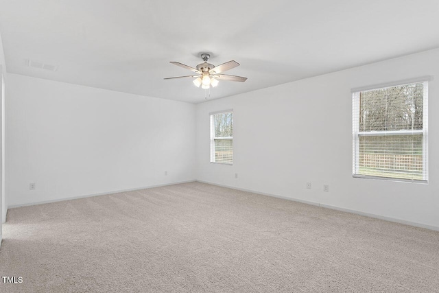 carpeted empty room with ceiling fan