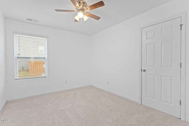 carpeted empty room with ceiling fan