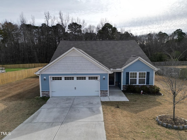 ranch-style house featuring a front lawn and a garage