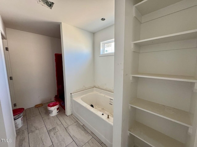 bathroom featuring a tub