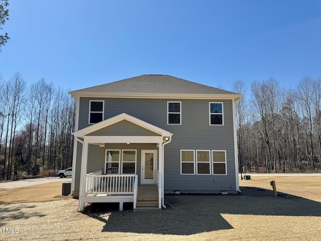 back of property featuring a porch