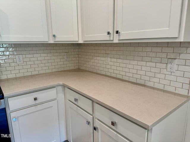 45 Covey Rise Way, Lillington, NC 27546 - kitchen featuring white cabinets, decorative backsplash, and light countertops
