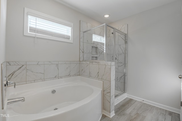 bathroom with separate shower and tub and hardwood / wood-style floors