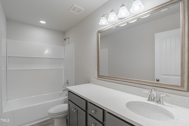 full bathroom with vanity, toilet, and  shower combination