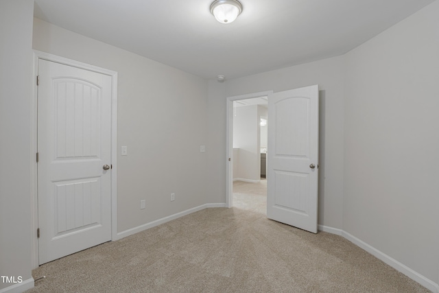 empty room featuring light carpet