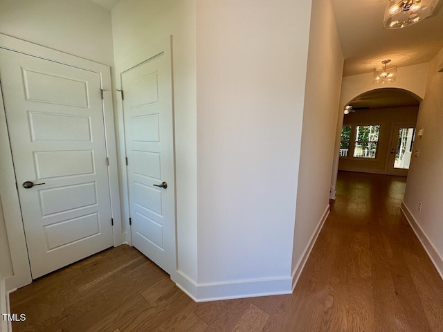 262 Grand Griffon Way, Lillington, NC 27546 - hallway featuring wood finished floors and arched walkways