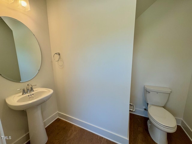 262 Grand Griffon Way, Lillington, NC 27546 - half bath featuring toilet and wood finished floors
