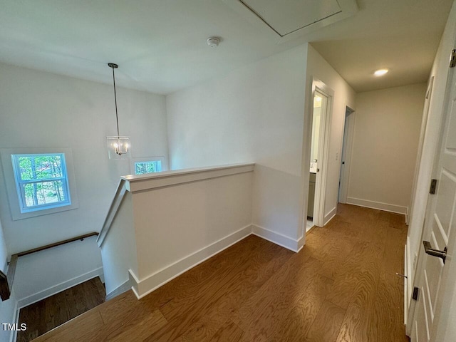 262 Grand Griffon Way, Lillington, NC 27546 - hall featuring an upstairs landing, dark wood-type flooring, and attic access