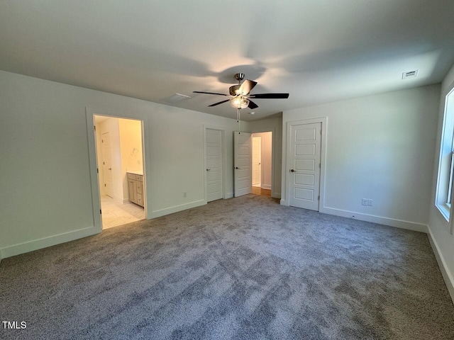 262 Grand Griffon Way, Lillington, NC 27546 - unfurnished bedroom with light carpet, ensuite bathroom, and ceiling fan