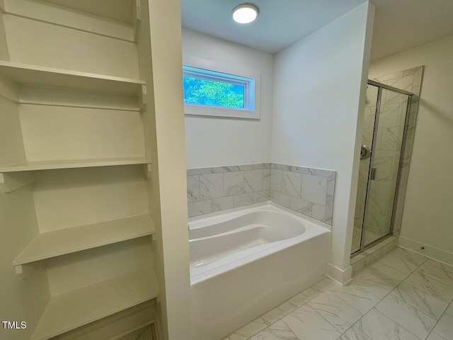 262 Grand Griffon Way, Lillington, NC 27546 - bathroom featuring a garden tub, marble look tiles, and a stall shower