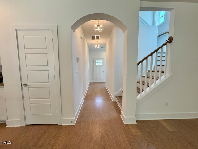 262 Grand Griffon Way, Lillington, NC 27546 - entrance foyer featuring wood finished floors, arched walkways, and stairway