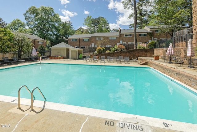 view of swimming pool featuring a patio