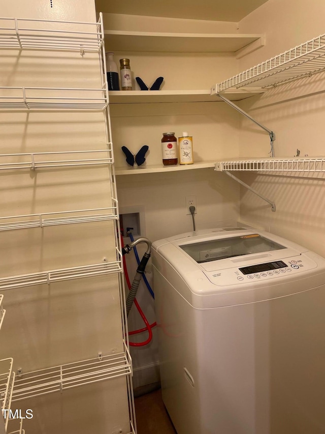 clothes washing area featuring washer / clothes dryer