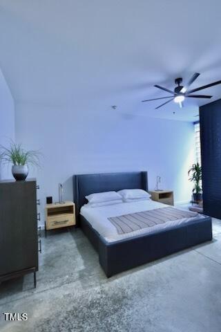 bedroom featuring finished concrete flooring and ceiling fan