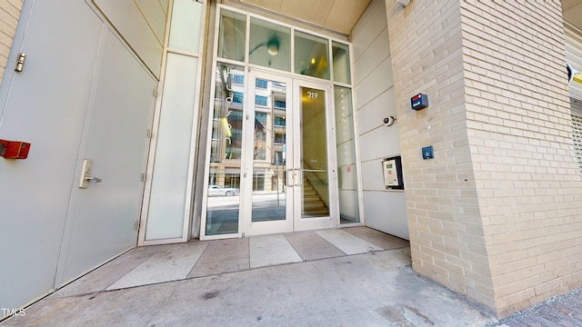 entrance to property with brick siding