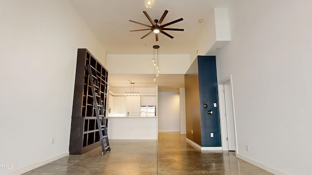 living room featuring concrete floors and baseboards