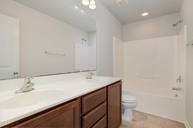 full bathroom featuring vanity, toilet, and bathtub / shower combination