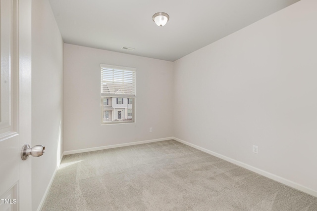 empty room with light colored carpet