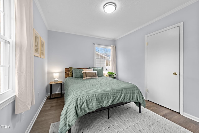 bedroom featuring hardwood / wood-style floors and crown molding