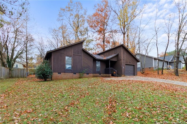 view of side of home with a garage