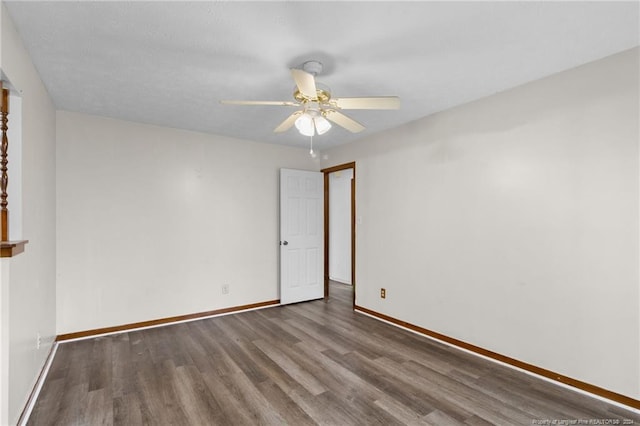 spare room featuring wood-type flooring, a textured ceiling, and ceiling fan