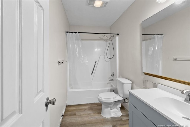 full bathroom with toilet, wood-type flooring, vanity, and shower / tub combo with curtain