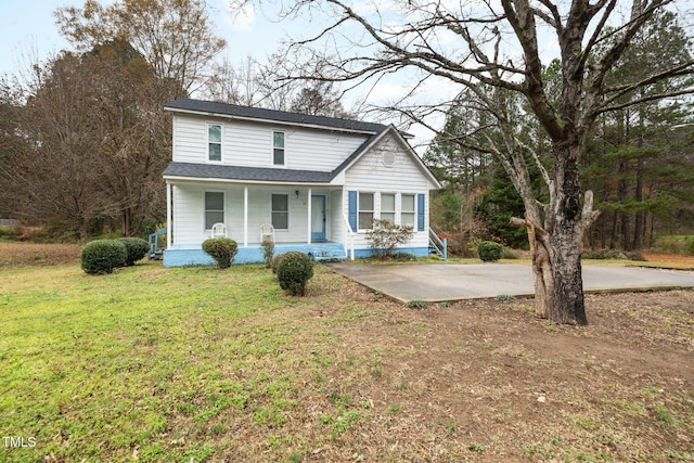 front of property with a front yard and a porch