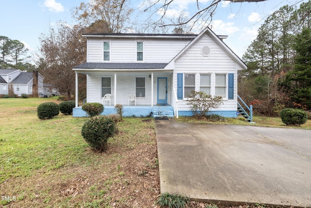 front of property featuring covered porch and a front yard