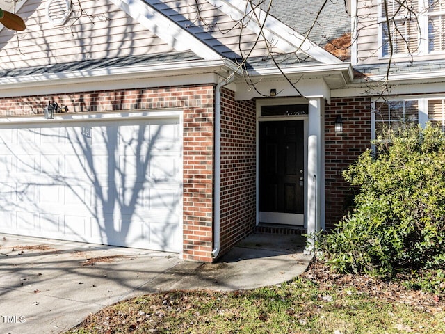 doorway to property featuring a garage