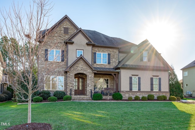 craftsman-style house featuring a front lawn