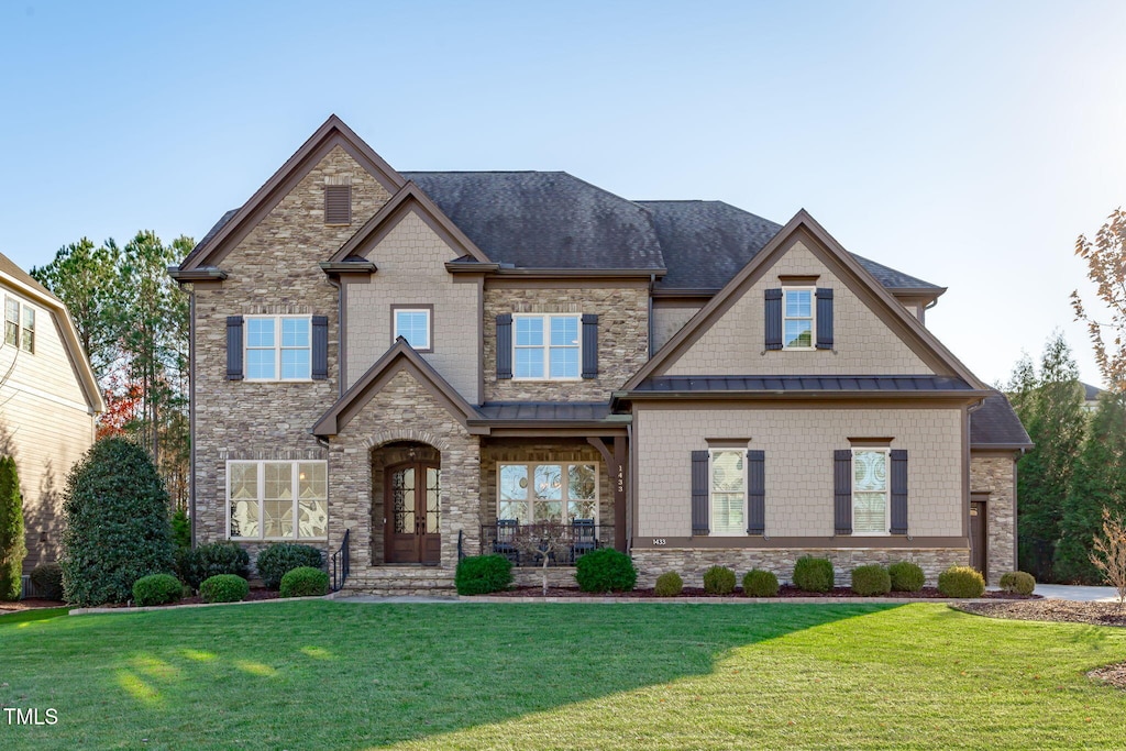 craftsman-style house with a front lawn