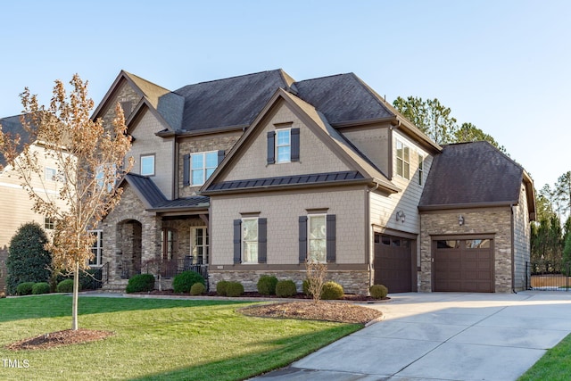 craftsman-style house featuring a front lawn and a garage