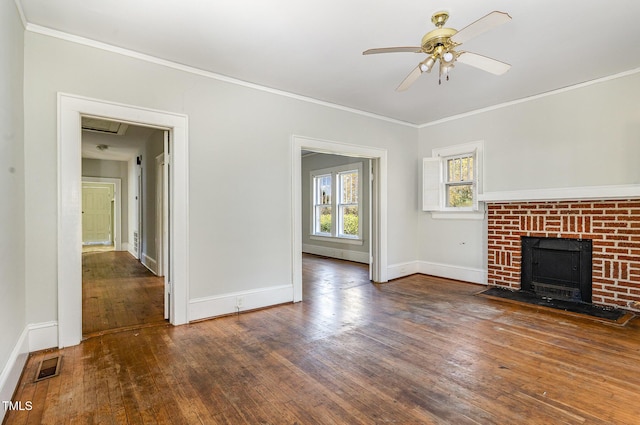 unfurnished living room featuring a fireplace, dark hardwood / wood-style floors, ceiling fan, and ornamental molding