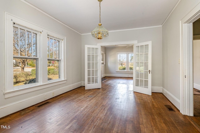 unfurnished dining area with french doors, dark hardwood / wood-style floors, and plenty of natural light