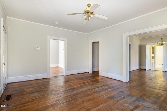 spare room with dark hardwood / wood-style flooring and ornamental molding