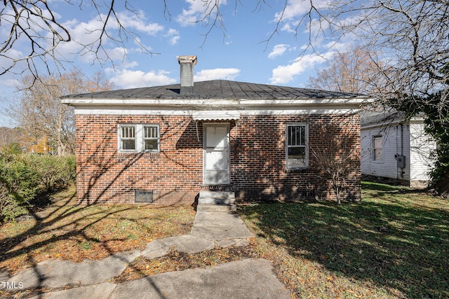 bungalow-style home with a front yard