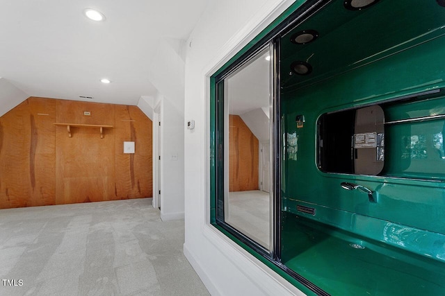 bathroom featuring vaulted ceiling