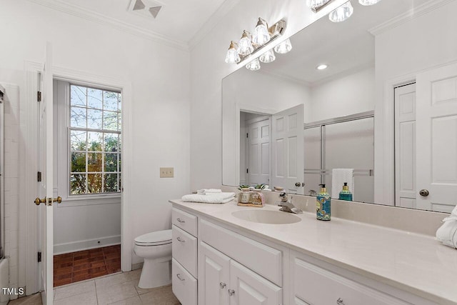 bathroom with tile patterned flooring, crown molding, toilet, vanity, and a shower with shower door