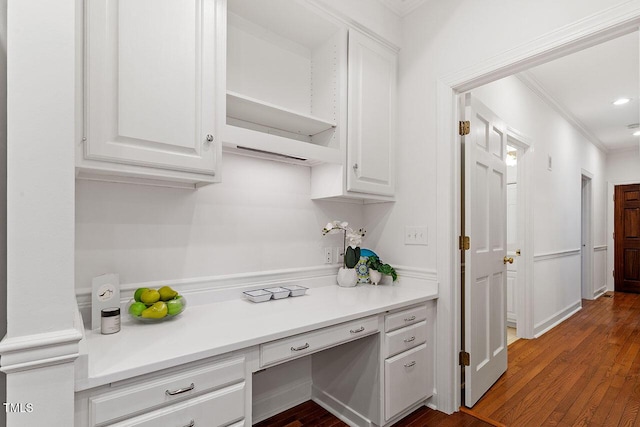 kitchen featuring ornamental molding, white cabinetry, and dark wood-type flooring