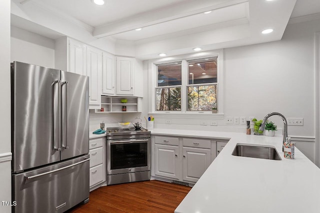 kitchen featuring sink, stainless steel appliances, dark hardwood / wood-style flooring, white cabinets, and ornamental molding