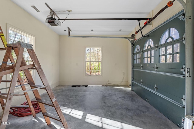 garage featuring a garage door opener