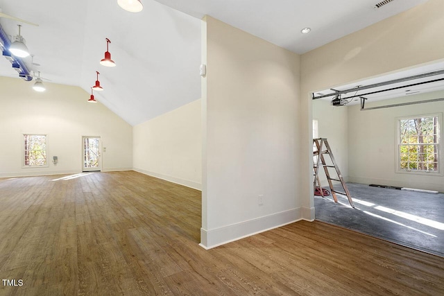 interior space with lofted ceiling and dark wood-type flooring